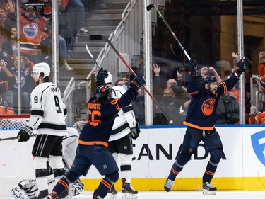 Edmonton Oilers' \o battles L.A. Kings' \k during second period NHL Stanley Cup playoffs action at Rogers Place in Edmonton, on Saturday, May 14, 2022.