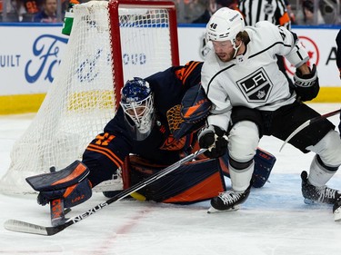 Edmonton Oilers' goaltender Mike Smith (41) stops L.A. Kings' Brendan Lemieux (48) during second period NHL Stanley Cup playoffs action at Rogers Place in Edmonton, on Saturday, May 14, 2022.
