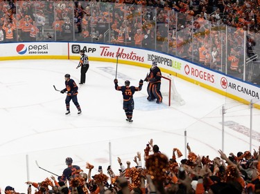 Edmonton Oilers' goaltender Mike Smith (41) and Zach Hyman (18) celebrate the team's 2-0 victory over the L.A. Kings during Game 7 of first round NHL Stanley Cup playoffs at Rogers Place in Edmonton, on Saturday, May 14, 2022.