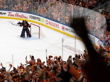 Edmonton Oilers' goaltender Mike Smith (41) and Zach Hyman (18) celebrate the team's 2-0 victory over the L.A. Kings during Game 7 of first round NHL Stanley Cup playoffs at Rogers Place in Edmonton, on Saturday, May 14, 2022.