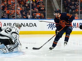 Edmonton Oilers' Josh Archibald (15) is stopped by L.A. Kings' goaltender Jonathan Quick (32) during third period NHL Stanley Cup playoffs action at Rogers Place in Edmonton, on Saturday, May 14, 2022.