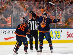 Edmonton Oilers' Connor McDavid (97) celebrates a goal with teammates on L.A. Kings' goaltender Jonathan Quick (32) during third period NHL Stanley Cup playoffs action at Rogers Place in Edmonton, on Saturday, May 14, 2022.