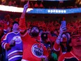 Hockey fans sing the national anthem as the Edmonton Oilers play the L.A. Kings during first round NHL Stanley Cup playoffs Game 7 action at Rogers Place in Edmonton, on Saturday, May 14, 2022.