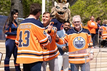 (Left to right) Oilers alumni Jason Strudwick, Dwayne Roloson and Craig MacTavish are seen during an Edmonton Oilers fan rally held at Sir Winston Churchill Square to cheer the Oilers' playoff journey in Edmonton on Tuesday, May 24, 2022. The Oilers face the Calgary Flames in Game 4 of the Battle of Alberta series at Rogers Place tonight.