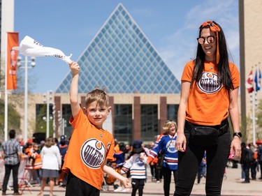 Teresa Marshall and her son Emery, 5 , won Game 4 tickets during an Edmonton Oilers fan rally held at Sir Winston Churchill Square cheer they cheer the Oilers' playoff journey with the rest of the city in Edmonton on Tuesday, May 24, 2022. The Oilers face the Calgary Flames in Game 4 of the Battle of Alberta series at Rogers Place tonight. It will be Emery's first Oilers game. Photo by Ian Kucerak