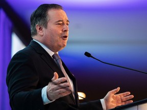 Premier Jason Kenney speaks at the Alberta Municipalities spring leaders caucus at the Edmonton Convention Center on March 10, 2022.