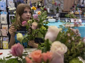 Miki Morrison, 13, Is part of a group of children from single-mom families taking part in a special training day as they learn how to make a floral bouquet for Mother's Day. These children demonstrate what children will be doing at an upcoming Love You Mama event on May 7th at Londonderry Mall. Taken on Tuesday, April 26, 2022 in St Albert .   Greg Southam-Postmedia