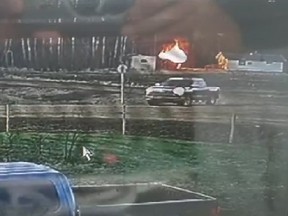 Surveillance footage shows a dark-coloured Chevrolet Silverado with an extended cab approaching a log home and trailer in Little Buffalo, 465 kilometres northwest of Edmonton, minutes before a fire started before 6 a.m. on Sunday, May 15, 2022.