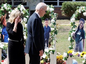 U.S. President Joe Biden and first lady Jill Biden pay their respects at the Robb Elementary School memorial, where a gunman killed 19 children and two teachers in the deadliest U.S. school shooting in nearly a decade, in Uvalde, Texas, U.S. May 29, 2022.