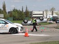 EPS collision Investigators work at the scene of a two-vehicle rollover collision along 149 Street at 131 Avenue on Wednesday, May 25, 2022.