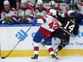 Edmonton Oil Kings forward Justin Sourdif (42) hits Red Deer Rebels forward Ben King during third period WHL action on Pride Day at Rogers Place in Edmonton on Saturday, April 9, 2022.