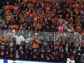 The Edmonton Oilers and their fans celebrate a empty-net goal against the Calgary Flames during their NHL playoff series at Rogers Place in Edmonton on Tuesday, May 24, 2022.
