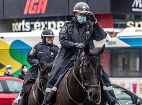 Montreal police officers on Wednesday, April 27, 2022. Photo by Dave Sidaway /Montreal Gazette