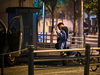 A resident walks on a street through the fence of a compound during a COVID-19 lockdown in the Jing’an district in Shanghai, China, Tuesday, May 3, 2022. Photo by HECTOR RETAMAL /AFP via Getty Images