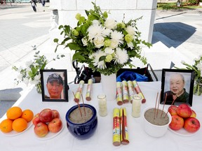 A memorial for Ban Hoang and Hung Trang outside city hall in Edmonton on May 28, 2022.