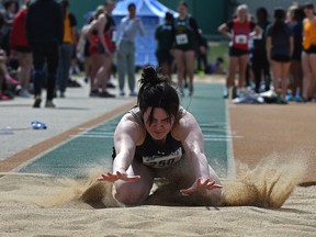 Jumping into the sandbox at the Triple Jump is Morgan Petras of Paul Kane High School in St. Albert during the Metro Senior High Division Track and Field Meeting at Foote Field in Edmonton on May 16, 2022.