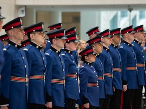Edmonton Police Service Recruit Training Class No. 153 officers are seen during their graduation ceremony at city hall in Edmonton, on Friday, May 13, 2022. It's the first such ceremony to be held in public since the beginning of the COVID-19 pandemic.