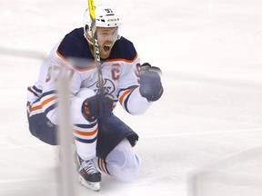 Edmonton Oilers Connor McDavid scores on Calgary Flames goalie Jacob Markstrom in overtime action to beat the Flames 5-4 and take Round two of the Western Conference finals at the Scotiabank Saddledome in Calgary on Thursday, May 26, 2022.