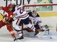 Andrew Mangiapane of the Calgary Flames has a chance in front of goalie Mike Smith of the Edmonton Oilers during the second period of action as the Calgary Flames host the Edmonton Oilers in Game 2 of the second round of the Stanley Cup Playoffs at the Saddledome. Friday, May 20, 2022.