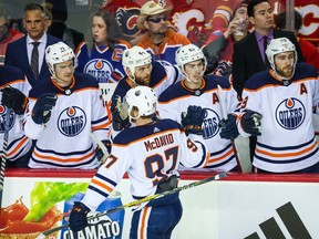 May 18, 2022; Calgary, Alberta, CAN; Edmonton Oilers center Connor McDavid (97) celebrates his goal with teammates against the Calgary Flames during the first period in game one of the second round of the 2022 Stanley Cup Playoffs at Scotiabank Saddledome.
