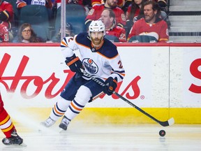 May 20, 2022; Calgary, Alberta, CAN; Edmonton Oilers defenseman Duncan Keith (2) controls the puck against the Calgary Flames during the third period in game two of the second round of the 2022 Stanley Cup Playoffs at Scotiabank Saddledome.