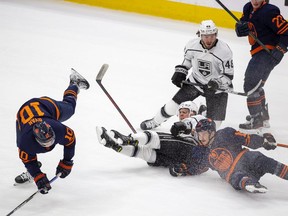 Edmonton Oilers Derek Ryan (10) and Josh Archibald (15) collide with Los Angeles Kings Brendan Lemieux (48) and Blake Lizotte (46) during first period NHL playoff action on Tuesday, May 10, 2022 in Edmonton.
