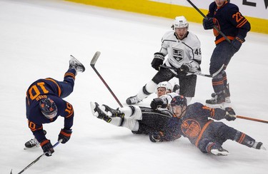 Edmonton Oilers Derek Ryan (10) and Josh Archibald (15) collide with Los Angeles Kings Brendan Lemieux (48) and Blake Lizotte (46) during first period NHL playoff action on Tuesday, May 10, 2022 in Edmonton.