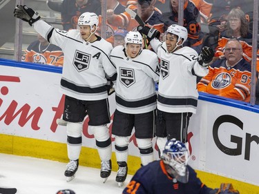 Los Angeles Kings Dustin Brown (23) , Blake Lizotte (46) and Andreas Athanasiou (22) celebrate a goal on Edmonton Oilers goaltender Mike Smith (41) during second period NHL playoff action on Tuesday, May 10, 2022 in Edmonton.