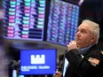 A trader works on the floor of the New York Stock Exchange.