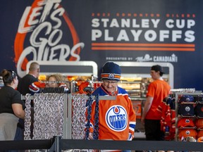 Edmonton Oilers fans check out Oilers merchandise at Rogers Place as they await the start of Game 6 between the Oilers and Los Angeles Kings.  Taken on Thursday, May 12, 2022 in Edmonton.  Greg Southam/Postmedia