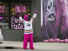 Marcia Lee wears a pink gorilla costume and a Connor McDavid