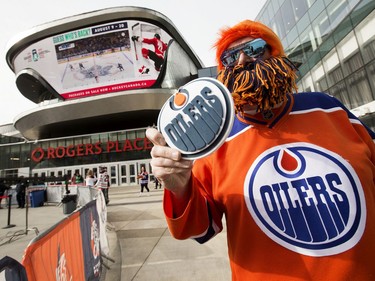 Edmonton Oilers fan Kelly Burake poses outside Rogers Place as he waits for the start of Game 5 between the Oilers and Los Angeles Kings, in Edmonton Tuesday, May 10, 2022.