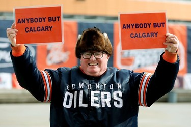 Edmonton Oilers fan Bill Aylwin pose for a photo outside Rogers Place as he wait for the start of Game 5 between the Oilers and Los Angeles Kings, in Edmonton Tuesday May 10, 2022.