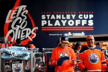 (left to right) Terry Albert and Kelsey Pooyak look at Edmonton Oilers merchandise at Rogers Place as they wait for the start of Game 5 between the Oilers and Los Angeles Kings, in Edmonton Tuesday May 10, 2022. Photo By David Bloom