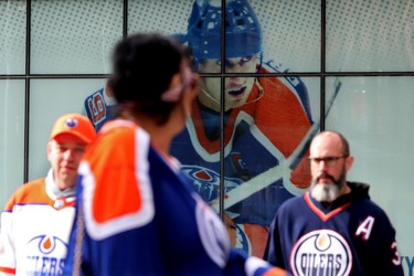 A photo of Wayne Gretzky looks on as Edmonton Oilers fans arrive at Rogers Place for the start of Game 5 between the Edmonton Oilers and Los Angeles Kings, in Edmonton Tuesday May 10, 2022. Photo By David Bloom