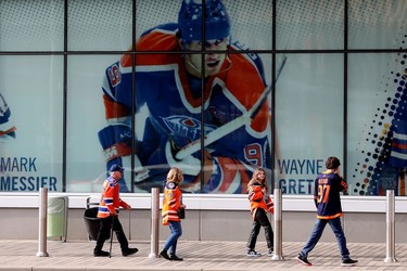 A photo of Wayne Gretzky looks on as Edmonton Oilers fans arrive at Rogers Place for the start of Game 5 between the Edmonton Oilers and Los Angeles Kings, in Edmonton Tuesday May 10, 2022. Photo By David Bloom