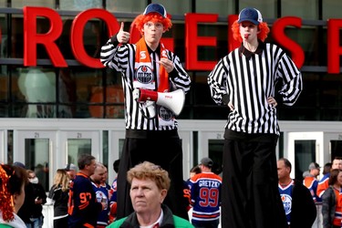 Edmonton Oilers fans and entertainment staff gather outside Rogers Place as they wait for the start of Game 5 between the Oilers and Los Angeles Kings, in Edmonton Tuesday May 10, 2022.