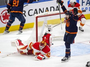 Edmonton Oilers Leon Draisaitl (29) celebrates Evander Kane (91) second goal on Calgary Flames goaltender Jacob Markstrom (25) during second period NHL second round playoff hockey action on Sunday, May 22, 2022 in Edmonton.