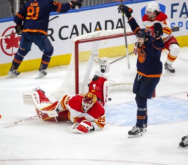 Edmonton Oilers Leon Draisaitl (29) celebrates Evander Kane (91) second goal on Calgary Flames goaltender Jacob Markstrom (25) during second period NHL second round playoff hockey action on Sunday, May 22, 2022 in Edmonton.