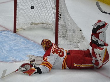 Calgary Flames goalie Jacob Markstrom (25) dives to stop the goal scored by Edmonton Oilers Ryan Nugent-Hopkins (93) during NHL playoff action at Rogers Place in Edmonton, May 24, 2022.