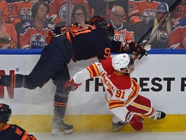 Edmonton Oilers Evander Kane (91) takes out Calgary Flames Calle Jarnkrok (91) during NHL playoff action at Rogers Place in Edmonton, May 24, 2022.