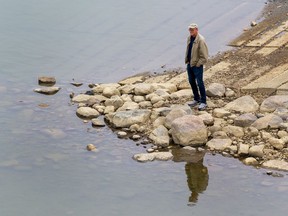 A man checked out the North Saskatchewan River from the Capilano Park boat launch on Wednesday, May 18, 2022 in Edmonton.