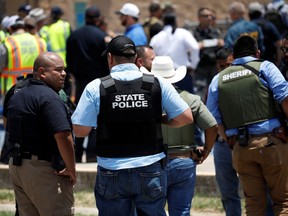 Law enforcement personnel guard the scene of a suspected shooting near Robb Elementary School in Uvalde, Texas, U.S. May 24, 2022.
