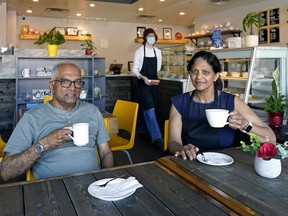 Marie Soochit, right, owner and operator of Cafe Bel-Air, and her brother Serge Sinsamy in the cafe located in Edmonton's Old Strathcona.