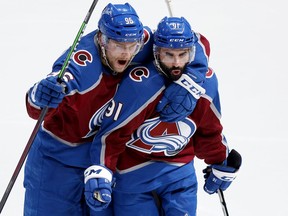DENVER, COLORADO - JUNE 02: Mikko Rantanen #96 and Nazem Kadri #91 of the Colorado Avalanche celebrate a goal scored by Artturi Lehkonen (not pictured) #62 on Mike Smith #41 of the Edmonton Oilers during the second period in Game Two of the Western Conference Final of the 2022 Stanley Cup Playoffs at Ball Arena on June 02, 2022 in Denver, Colorado.