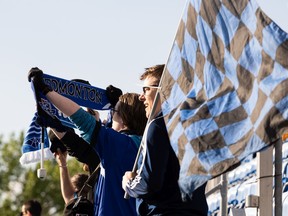 FC Edmonton fans stand for the national anthem as the team plays Forge FC in first half Canadian Premier League soccer action at Clarke Stadium in Edmonton, on Tuesday, May 31, 2022.