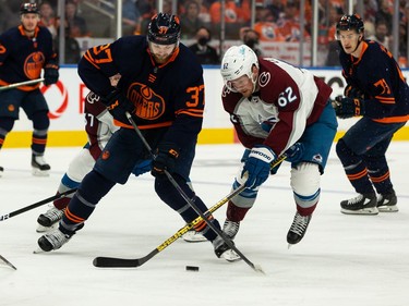 Edmonton Oilers' Warren Foegele (37) battles Colorado Avalanche's Artturi Lehkonen (62) during first period of Game 4 of the NHL Western Conference Final action at Rogers Place in Edmonton, on Monday, June 6, 2022.