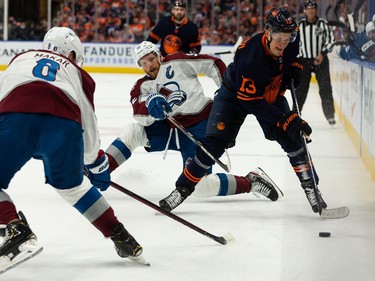 Edmonton Oilers' Jesse Puljujarvi (13) battles Colorado Avalanche's Gabriel Landeskog (92) and Cale Makar (8) during first period of Game 4 of the NHL Western Conference Final action at Rogers Place in Edmonton, on Monday, June 6, 2022.