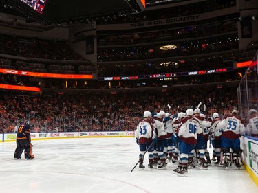 Edmonton Oilers' goaltender Mike Smith (41) skates past the Colorado Avalanche celebrating their overtime win over the Edmonton Oilers in Game 4 of the NHL Western Conference Final at Rogers Place in Edmonton, on Monday, June 6, 2022.