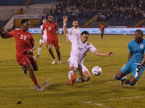 Canada striker Jonathan David (20) scores against Honduras in a Concacaf Nations League game on June 13, 2022 in San Pedro Sula, Honduras.